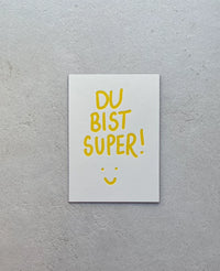 LETTERPRESS CARD "DU BIST SUPER!" YELLOW/LILAC
