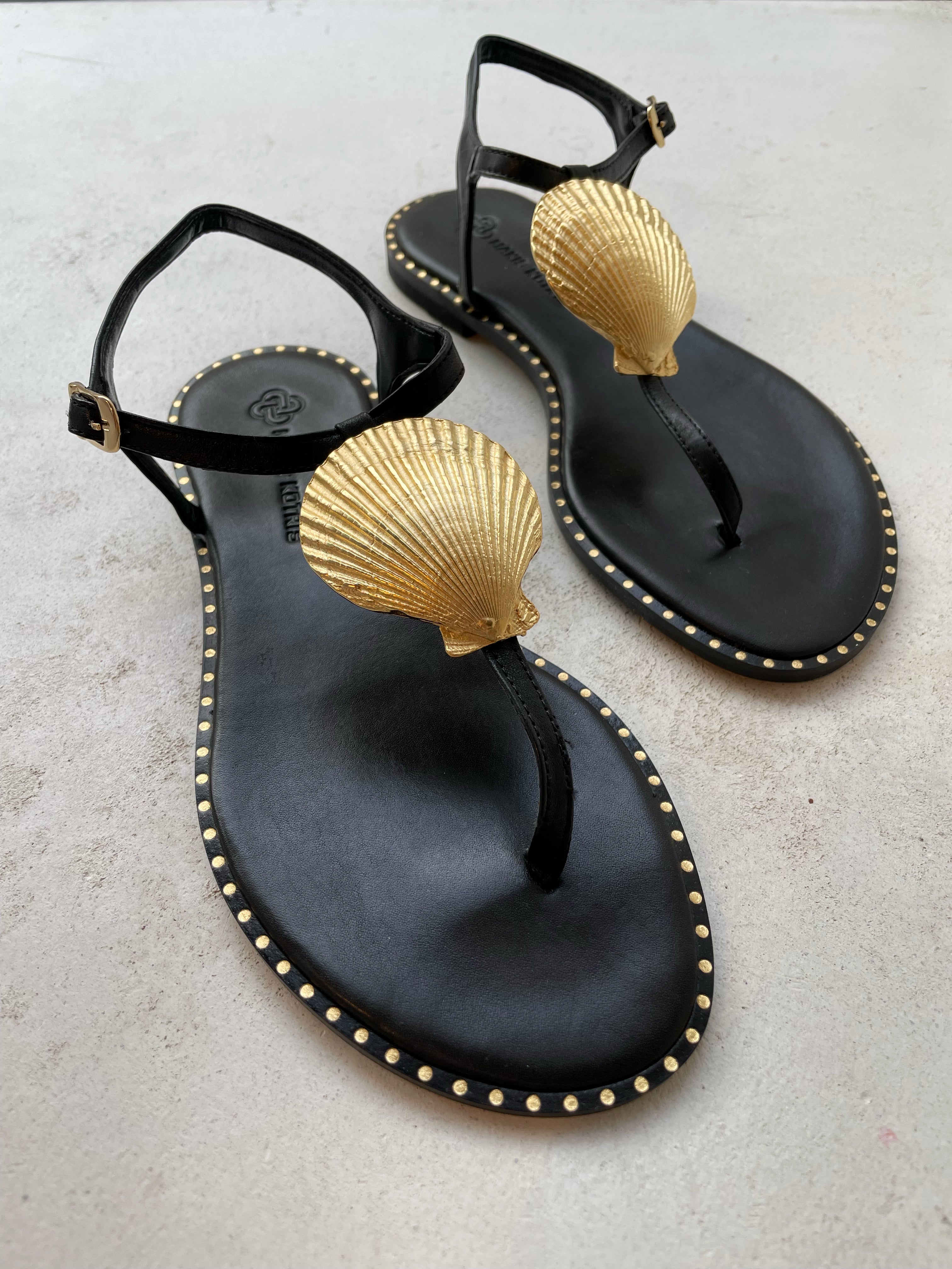 Black and gold sandals on sale